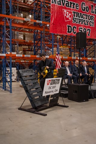 Photo: Tractor Supply CEO Hal Lawton cuts a pallet to officially open the company’s newest distribution center in Navarre, OH. (Photo: Business Wire)