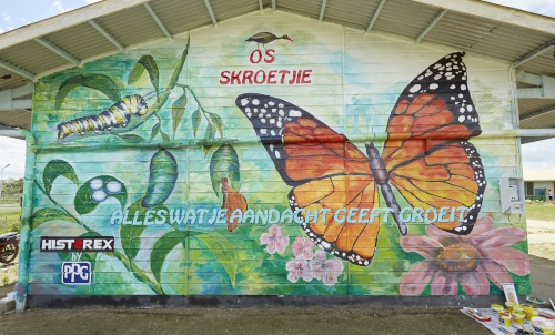 Photo: PPG provided a colorful makeover including a mural at the OS Skroetjie school in Suriname through the company's New Paint for a New Start initiative.