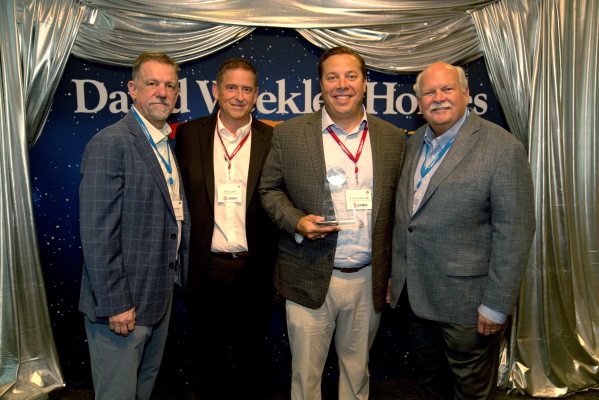 From left to right: David Weekley Homes Vice President of Purchasing & Supply Chain John Schiegg, 84 Lumber Florida Vice President of Sales Tim Craver, Western Division Vice President of Sales Clint Ciomperlik, and Chairman David Weekley